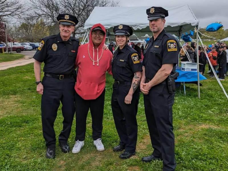 Jio Rodriguez with the police officers who helped save his life. From left: Officer Wayne Perritt, Officer Pamela Young, Rodriguez and Lt. Richard Homestead. (Photo courtesy of Richard Homestead)